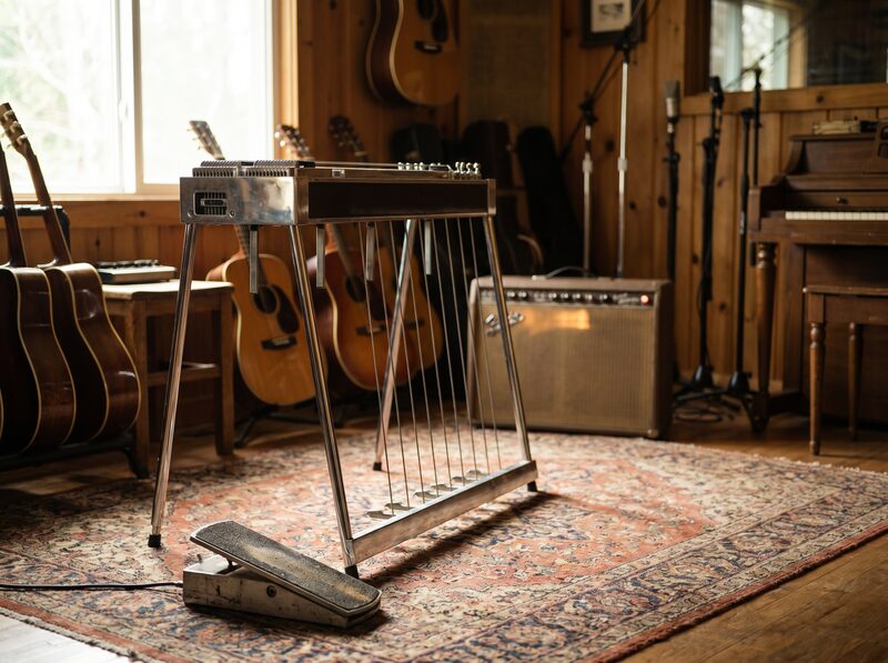 Pedal steel guitar in a warm recording room.